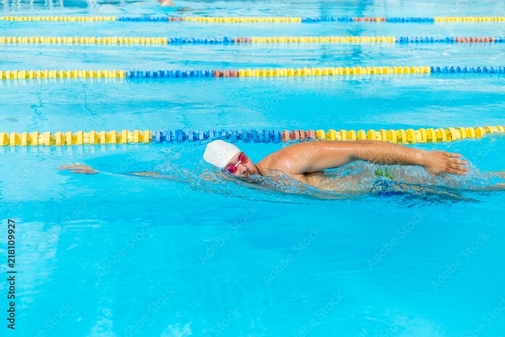 Man swims sidestroke in the pool