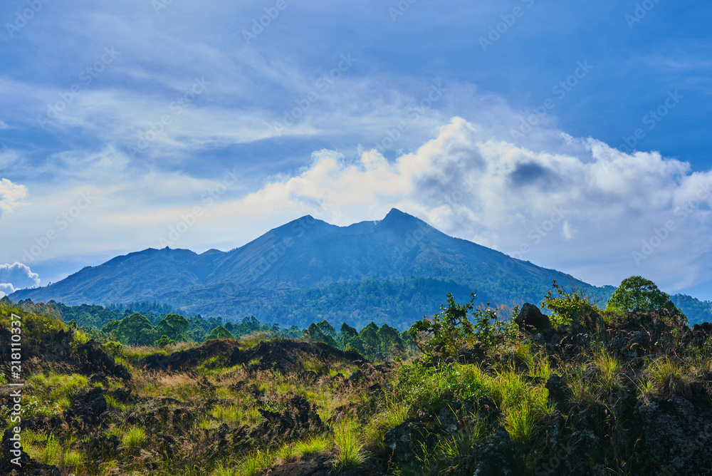 Fantastic view of Batur volcano on Bali island, Indonesia. Picturesque and gorgeous morning scene. Beauty world. Awesome valley in bright light. Picture of a wild area. Fantastic morning mountain.