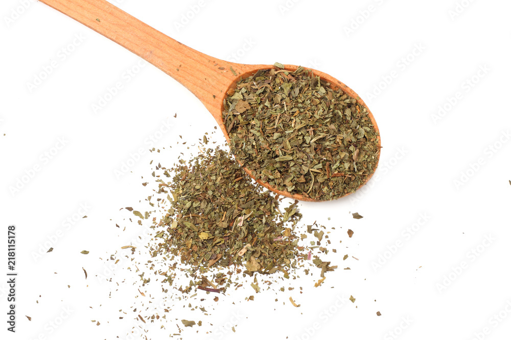 dried mint in wooden spoon isolated on white background dried mint in wooden spoon isolated on white background