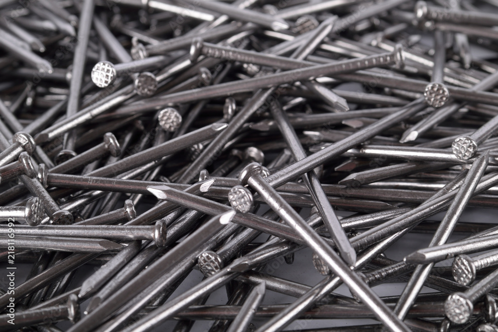Full frame background showing lots of metallic metal iron nails Full frame background showing lots of metallic metal iron nails