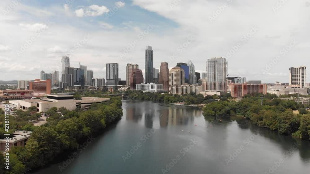 Flying towards the Austin, Texas Skyline above the Colorado River on a Hot Summer Day Flying towards the Austin, Texas Skyline above the Colorado River on a Hot Summer Day
