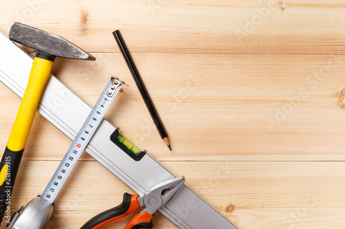 Set of hand tools on wooden table. Instruments on wooden background. Repair tools. Top view. Flat lay. Close-up. Copy space