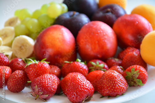 the fruit on the plate  fruit  food  apple  fresh  grape  orange healthy  grapes  fruits  ripe  green  red  isolated  plum  white  strawberry  juicy  diet  sweet  vegetable  cherry  yellow  tropical 