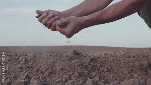 slow motion video of Human's hands hold earth dust. Drought, land without rain