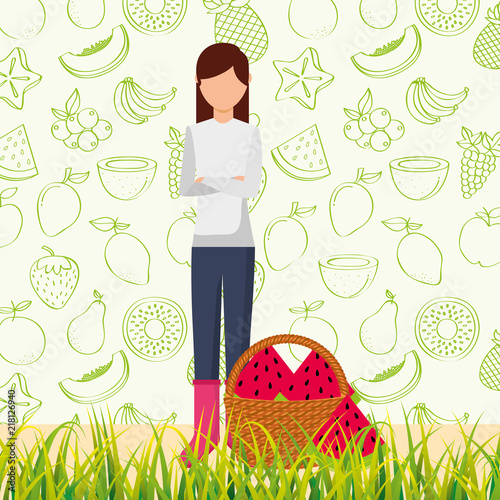 woman with basket full watermelon in the grass