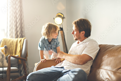 Portrait of happy son with father at home © Louis-Photo