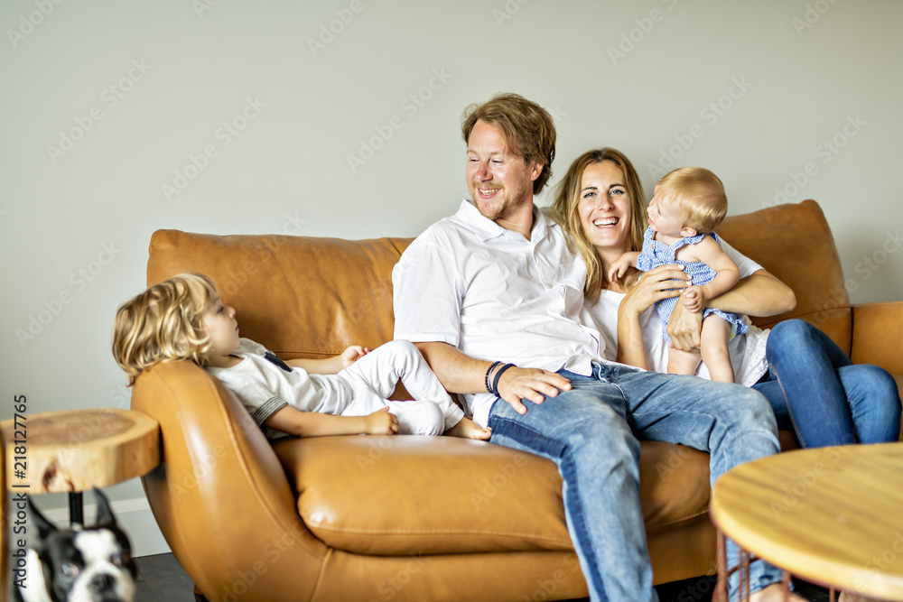 Family having fun on sofa. Family having fun on sofa.