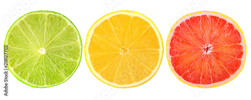 Fresh citrus fruits cut in half isolated on white