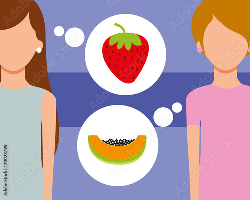two woman talking of fruits fresh strawberry papaya
