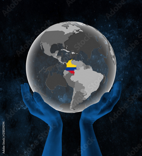 Fototapeta Naklejka Na Ścianę i Meble -  Colombia on globe in hands in space