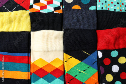 Many colorful socks as background, top view