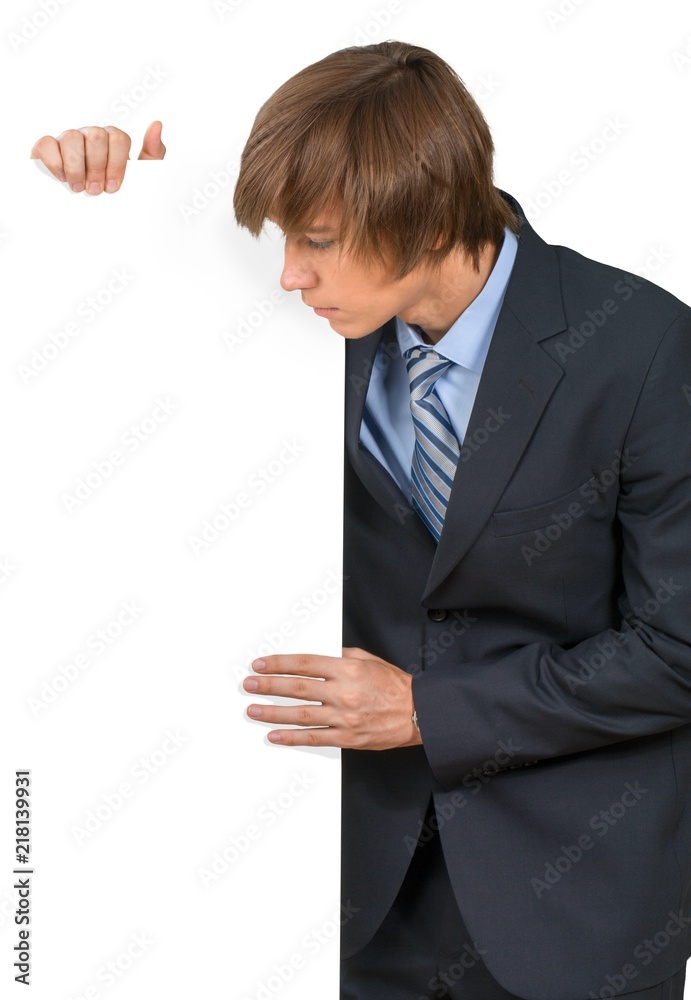 Young male in business suit with invisible object Young male in business suit with invisible object