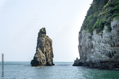 Stone pillar emerged from the sea is the part of Geoje Haegeumgang rock islands in the Hanryeo marine national Park, Geoje City, South Korea.
