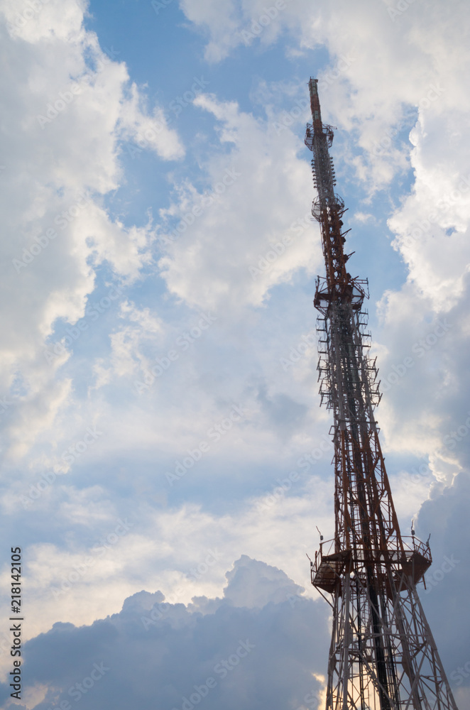 Radio tower and sky with sunshine after rain