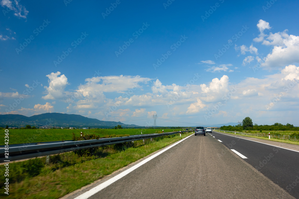 Highway in Croatia with mountains in the background Highway in Croatia with mountains in the background