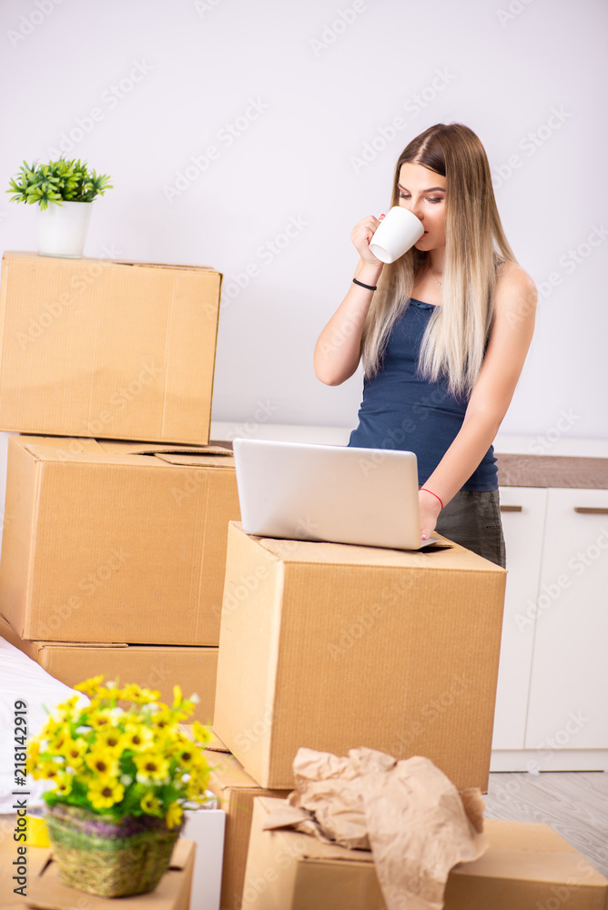 Fototapeta premium Young woman moving to new place
