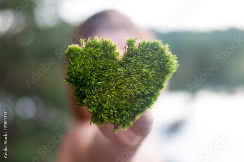 hands holding green heart shaped tree love nature save the world heal the world environmental preservation
