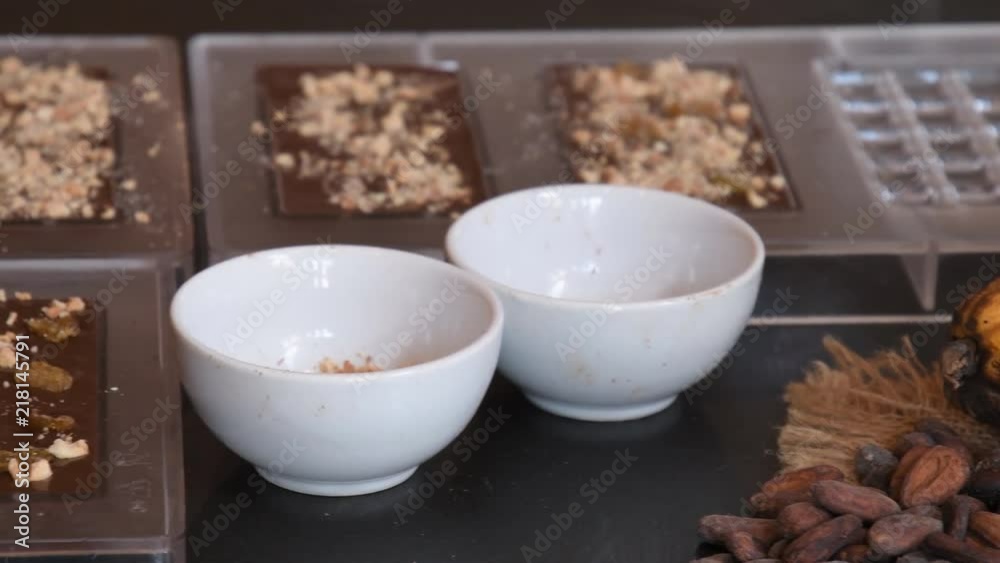chef dressed making handmade chocolate candy in the cafe, Chocolate in mold, make praline chef dressed making handmade chocolate candy in the cafe, Chocolate in mold, make praline