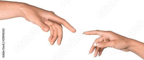 People Reaching to Touch Fingers