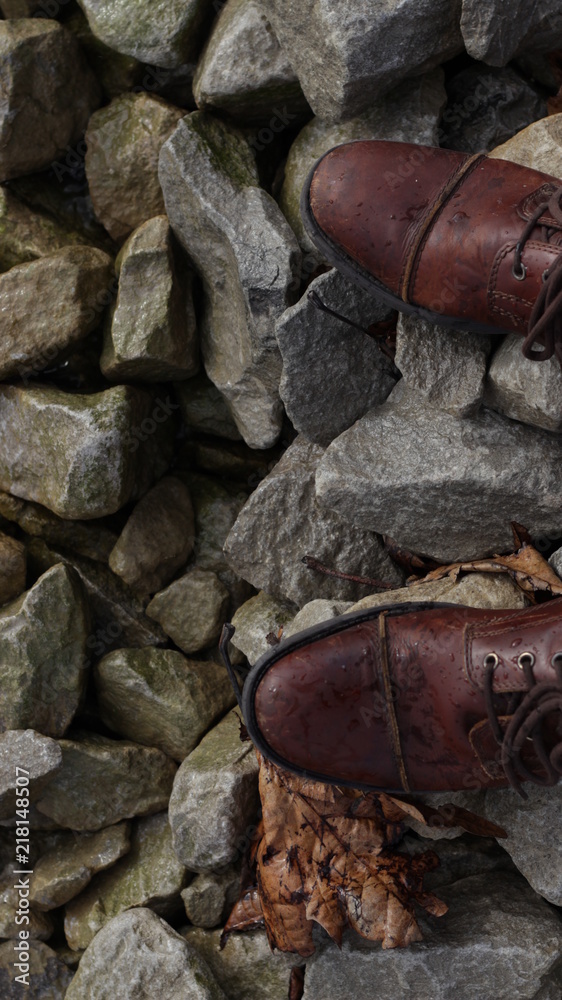 Close up of boots on rocks