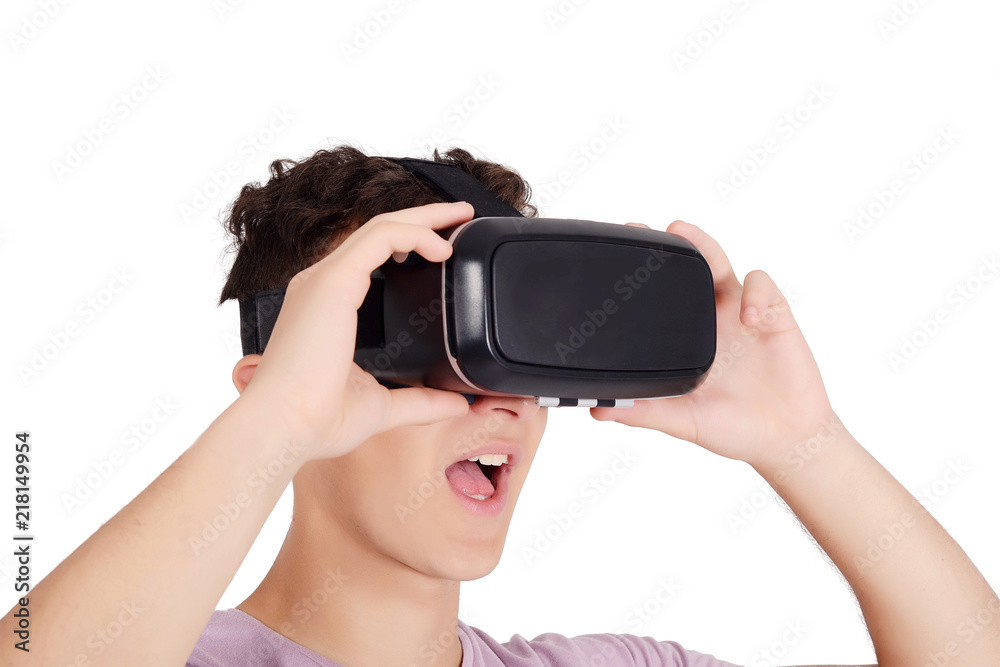 Joyful teen boy using VR goggles Joyful teen boy using VR goggles