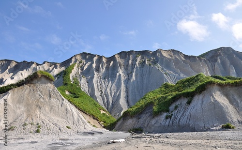 white steep shore of volcanic origin of iturup island photo