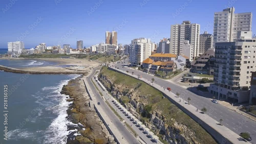 Rambla Patricio Ramos at Playa Varese on the coast of Mar del Plata Argentina – 4k drone video of the Argentinian coast Mar del Plata Casino Central in spring.  Buenos Aires Capital Federal district  