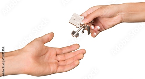 Hands Passing House Keys