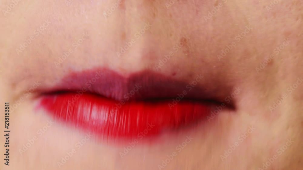 Woman quickly applying red lipstick, DETAIL CLOSEUP Woman quickly applying red lipstick, DETAIL CLOSEUP