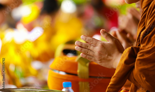 Photography Hand of monk in Buddhist prayer process.