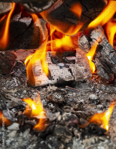 Coals in a hot fire close up.