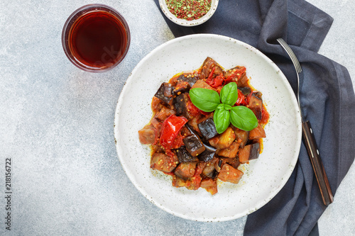 Fototapeta Naklejka Na Ścianę i Meble -  Caponata is a traditional Sicilian dish. Stew of vegetables-eggplant, tomatoes, onions, Basil and olives with seasonings and spices