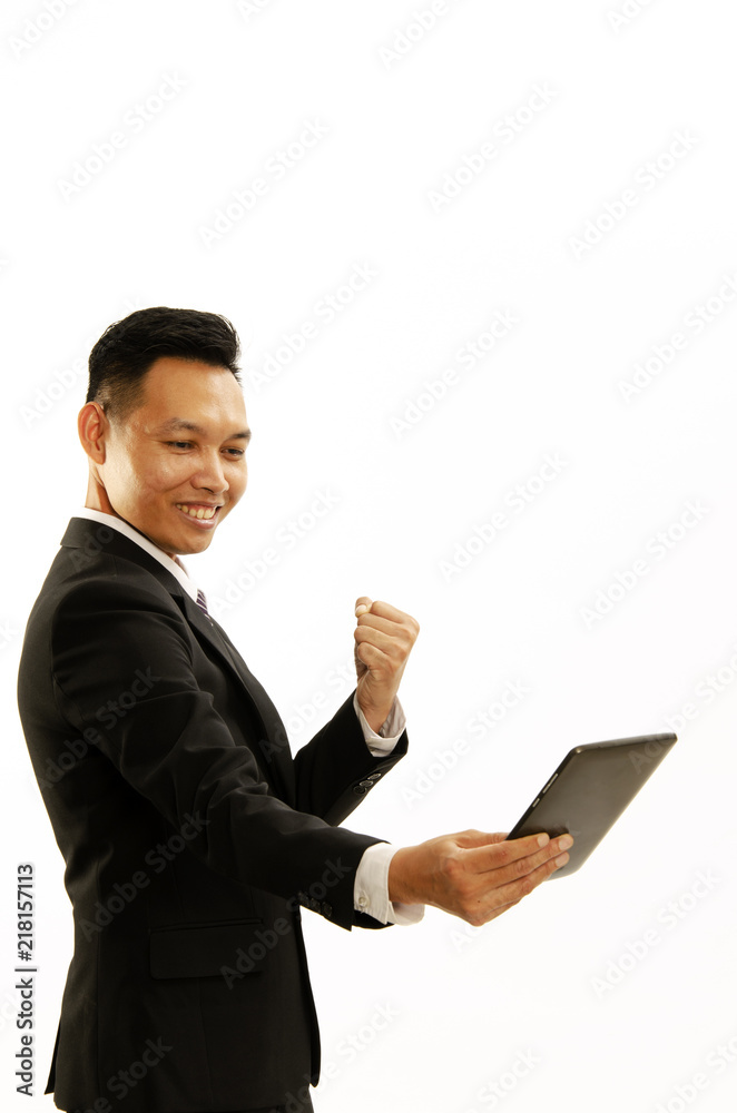 Asian Business man hand holding tablet and giving fist Isolated on white backgrounds Asian Business man hand holding tablet and giving fist Isolated on white backgrounds