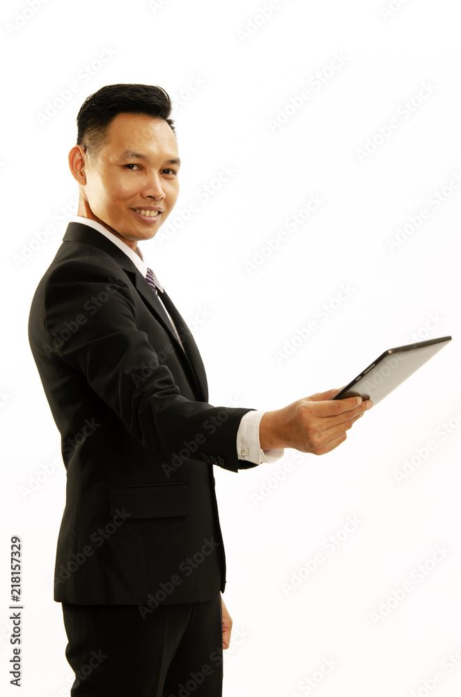 Asian business man with smile and hand holding tablet and giving forward on white backgrounds. Place for you text Asian business man with smile and hand holding tablet and giving forward on white backgrounds. Place for you text