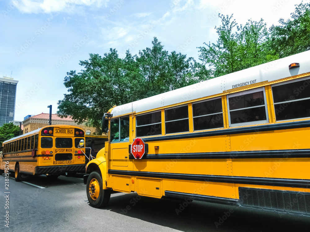 The traditional school buss on freeway road at Orlando, Florida, USA