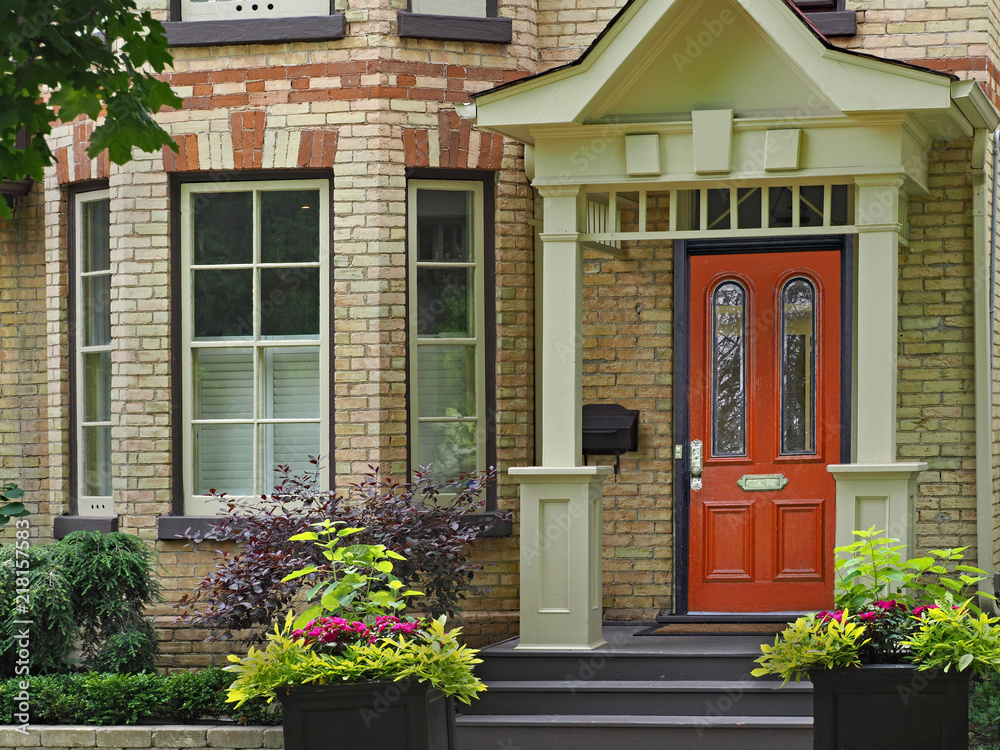 Fototapeta premium front door of Victorian house with multicolored brick