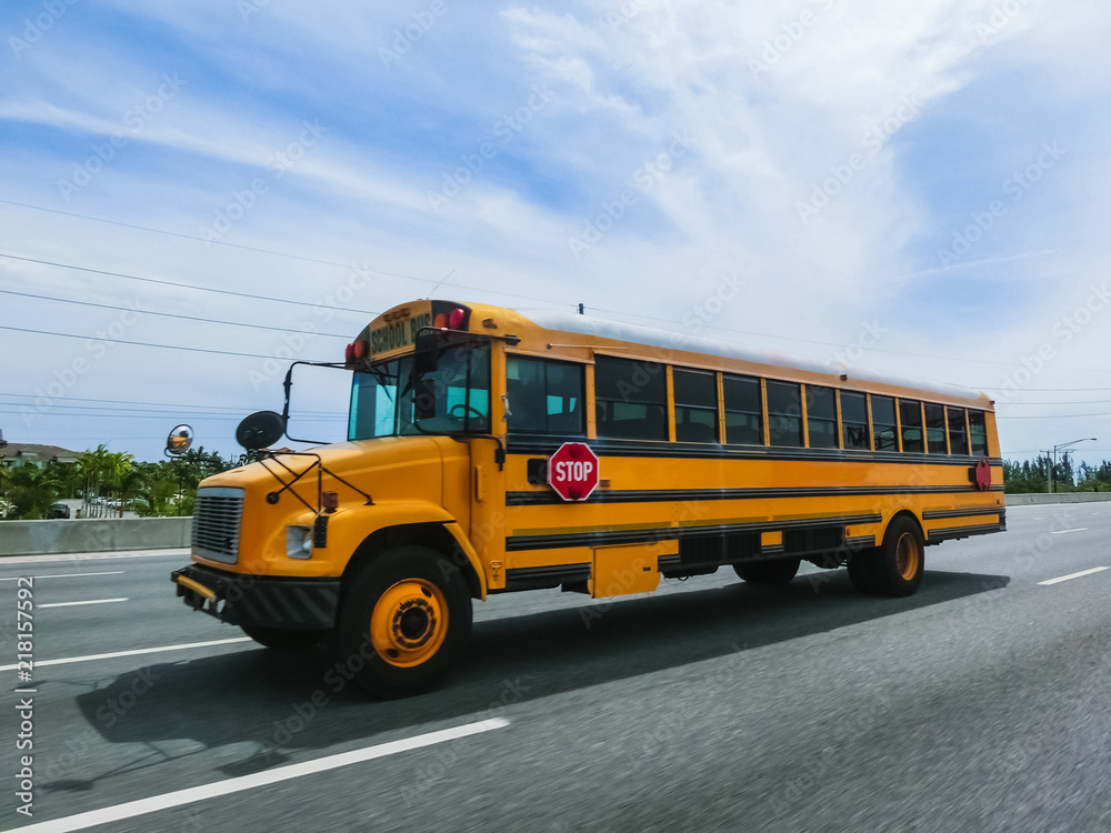 The traditional school buss on freeway road at Orlando, Florida, USA The traditional school buss on freeway road at Orlando, Florida, USA