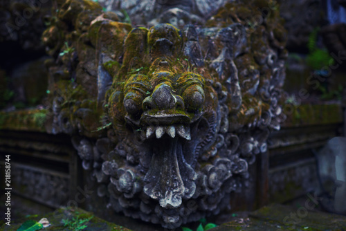 Beautiful view of ancient stone carving of temple on Bali island. Gunung Kawi Temple and Candi in jungle at Bali, Indonesia. Old temples in the jungle. Ancient temple ruins. Carved in stone temple.