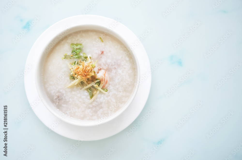 porridge rice with shrimp in white bowl. top view photo porridge rice with shrimp in white bowl. top view photo