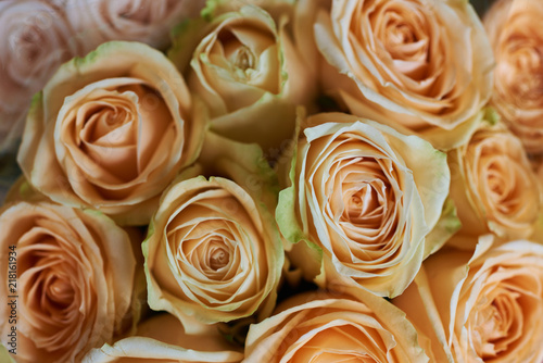 Beautiful fresh bouquet. Natural roses background. Retro filter. Festive assorted roses. Various soft roses top view. Unfocused blur rose, abstract romance background, soft flower card.