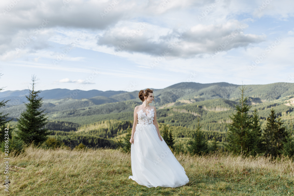 Bride in the mountains. The concept of lifestyle and wedding.