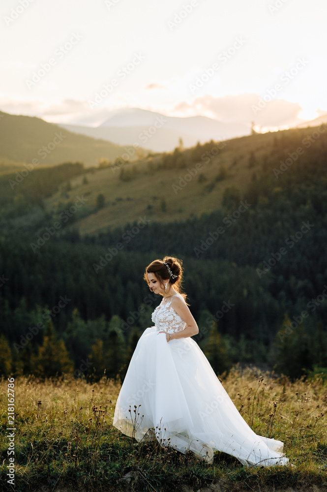 Bride in the mountains. The concept of lifestyle and wedding.