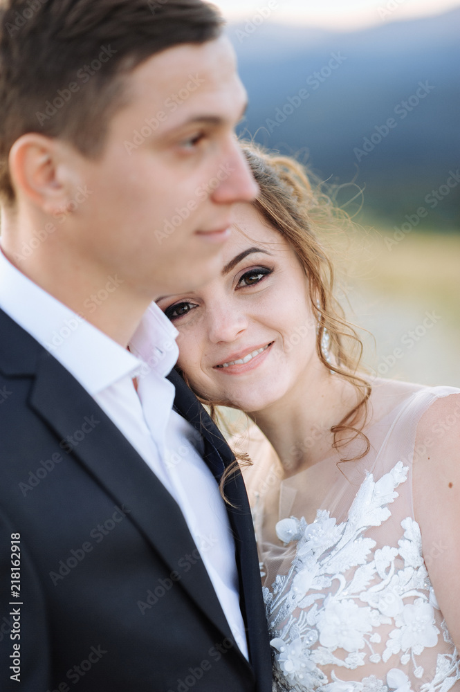 Beautiful bride and groom at the mountains Beautiful bride and groom at the mountains