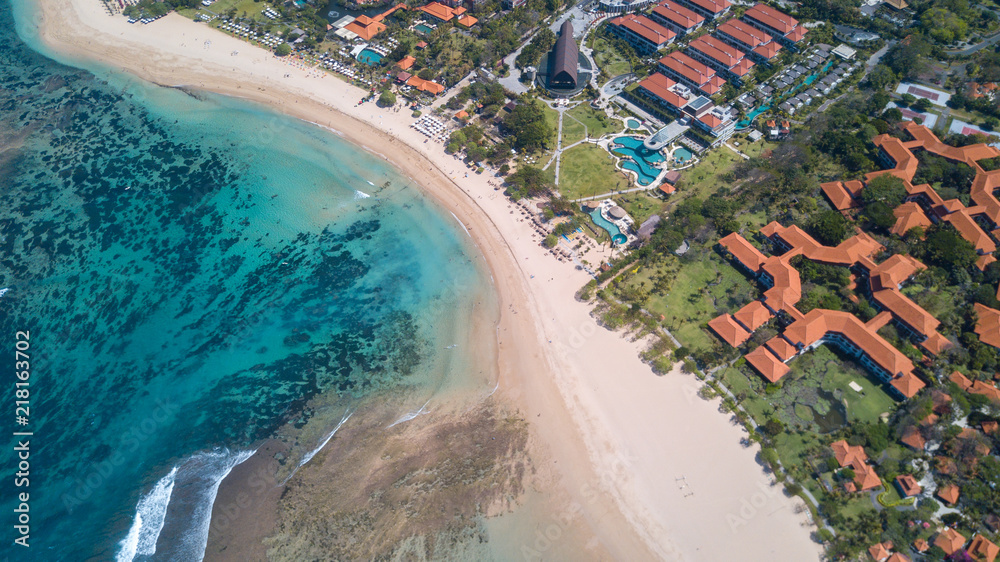 Above luxury secluded  beachfront resort with ocean view,Bali island with sandy coastline at Nusa Dua beach line,Indonesia