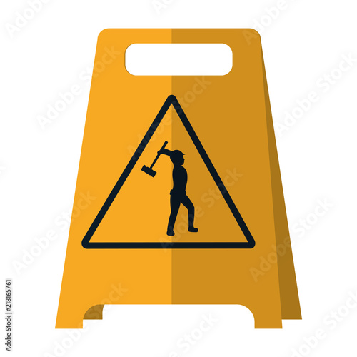 plastic caution emblem and laborer with mallet
