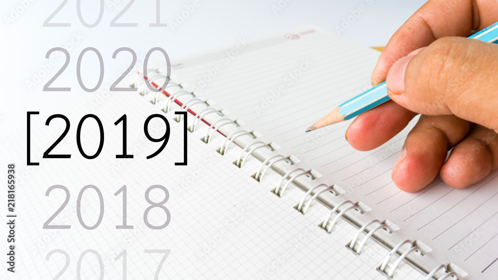 notebook paper close up view with pencil and number of 2019 year notebook paper close up view with pencil and number of 2019 year