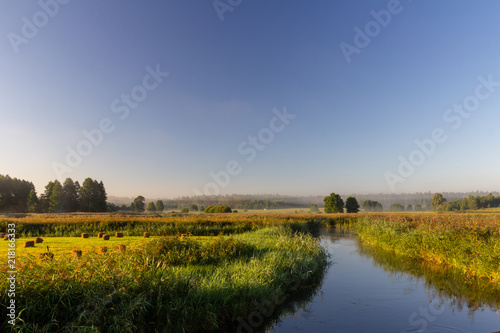 Rural landscape of farmland by the river