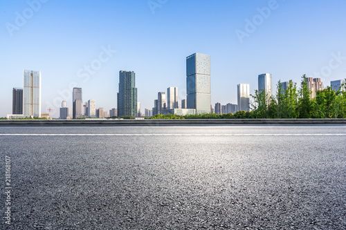 city skyline with emtpy asphalt road