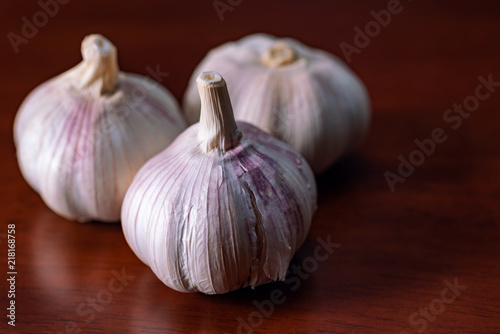 garlic cloves on wooden table