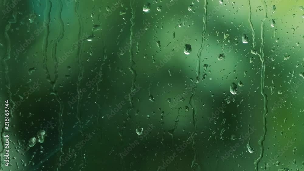 Stormy rainy weather behind the window, close up dolly shot of rain drops streaming slowly, nature and severe weather concept, FullHD 1080p Stormy rainy weather behind the window, close up dolly shot of rain drops streaming slowly, nature and severe weather concept, FullHD 1080p